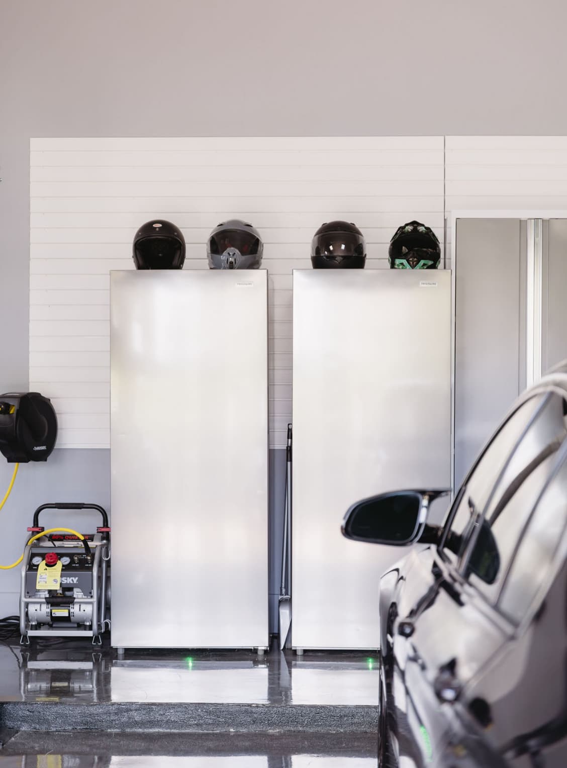 Slatwall garage organization with shelving and storage by My Ultimate Garage